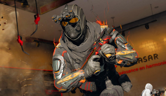 Black Ops 6 Season 2: An operator in a black and orange military suit with flames coming off of his arms and shoulders